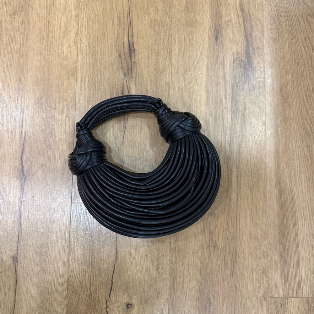 black woven handbag